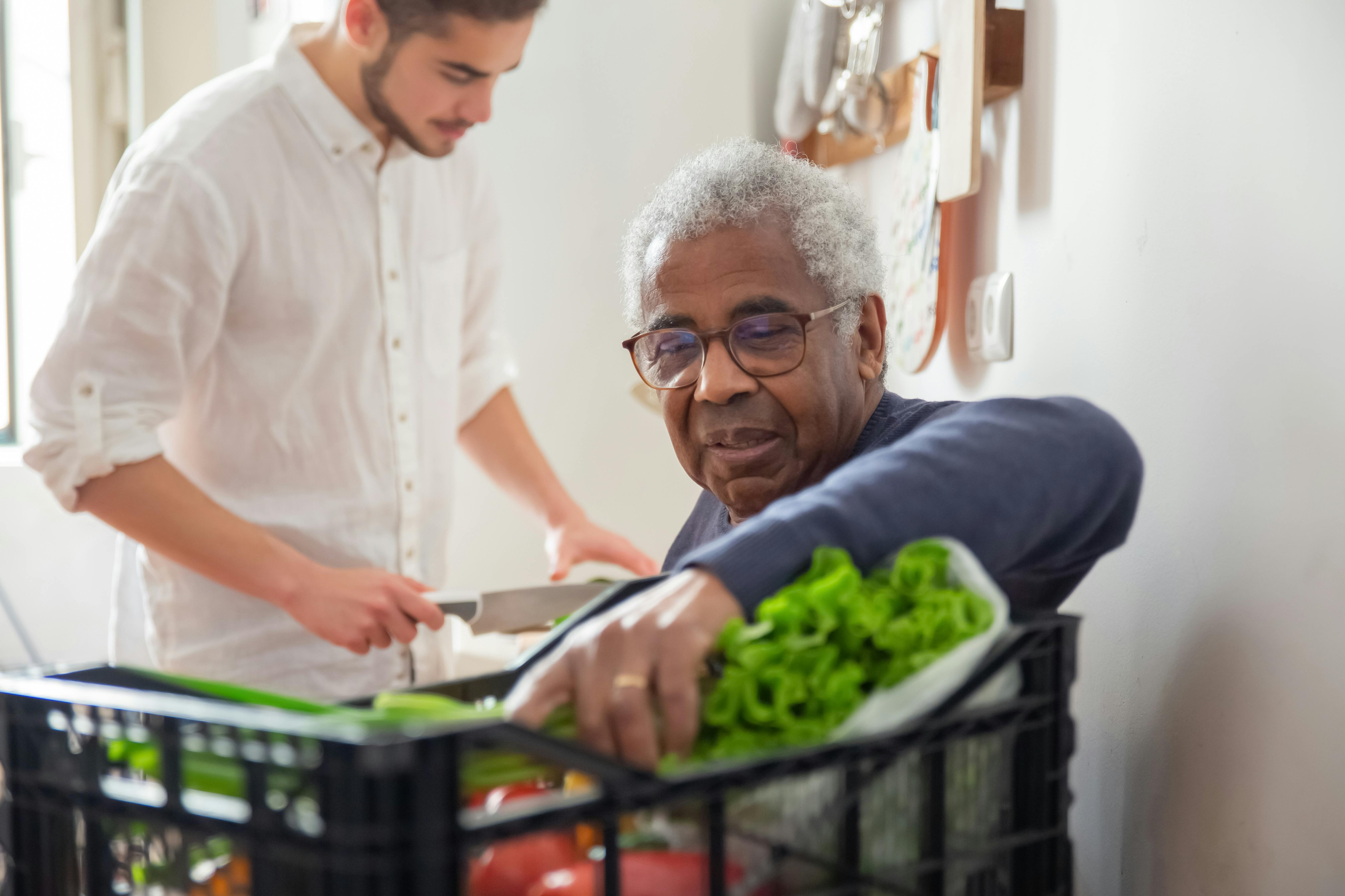 Caregiver and senior with vegetables